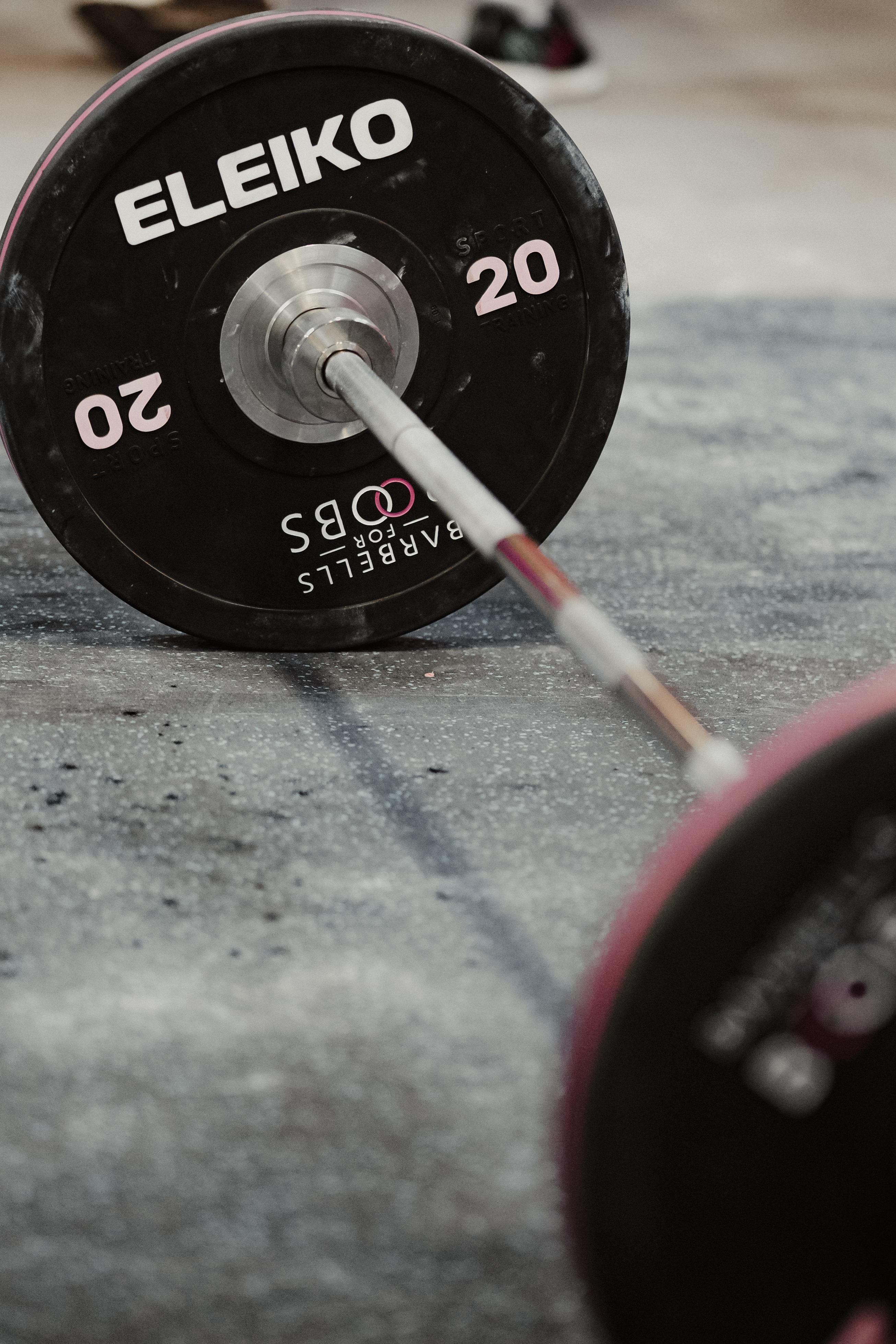 Close-up of an Eleiko weight plate with Barbells for Boobs branding